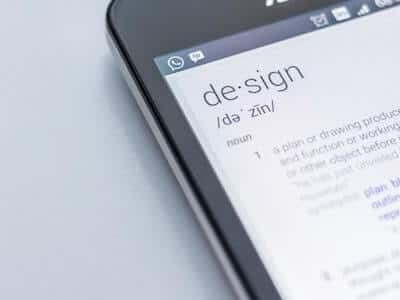 Photo of phone with the definition of design - UX tips for websites - photo by edho-pratama-