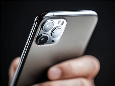 Apple device held in hand of user for Apple iOS14 changes