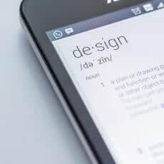 FEAT Photo of phone with the definition of design - UX tips for websites