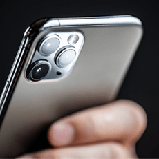 Apple device in users hand for Apple iOS14 changes